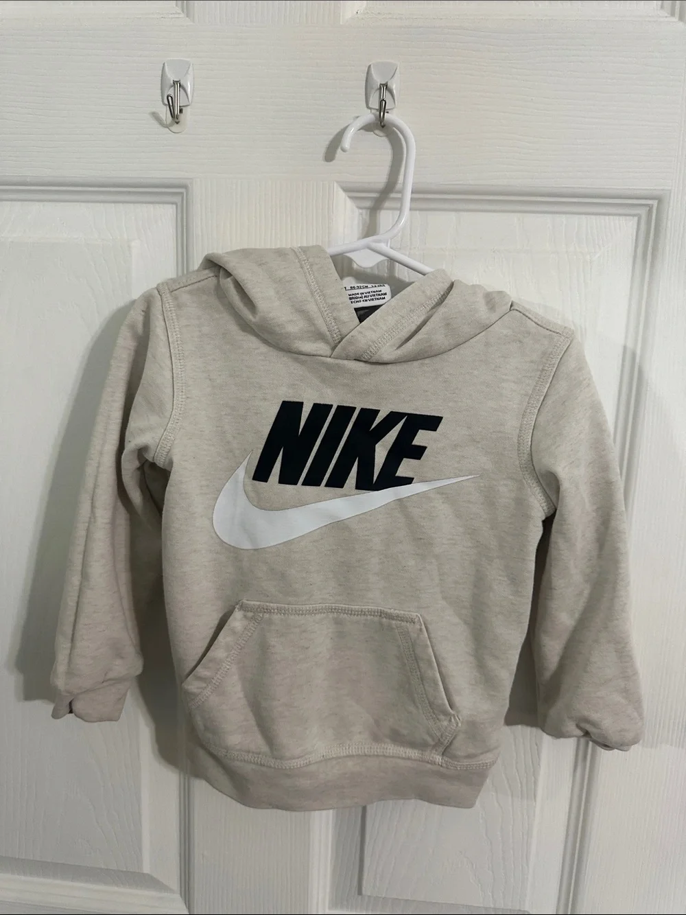 Nike Kids Beige Hoodie with Black Logo and White Swoosh